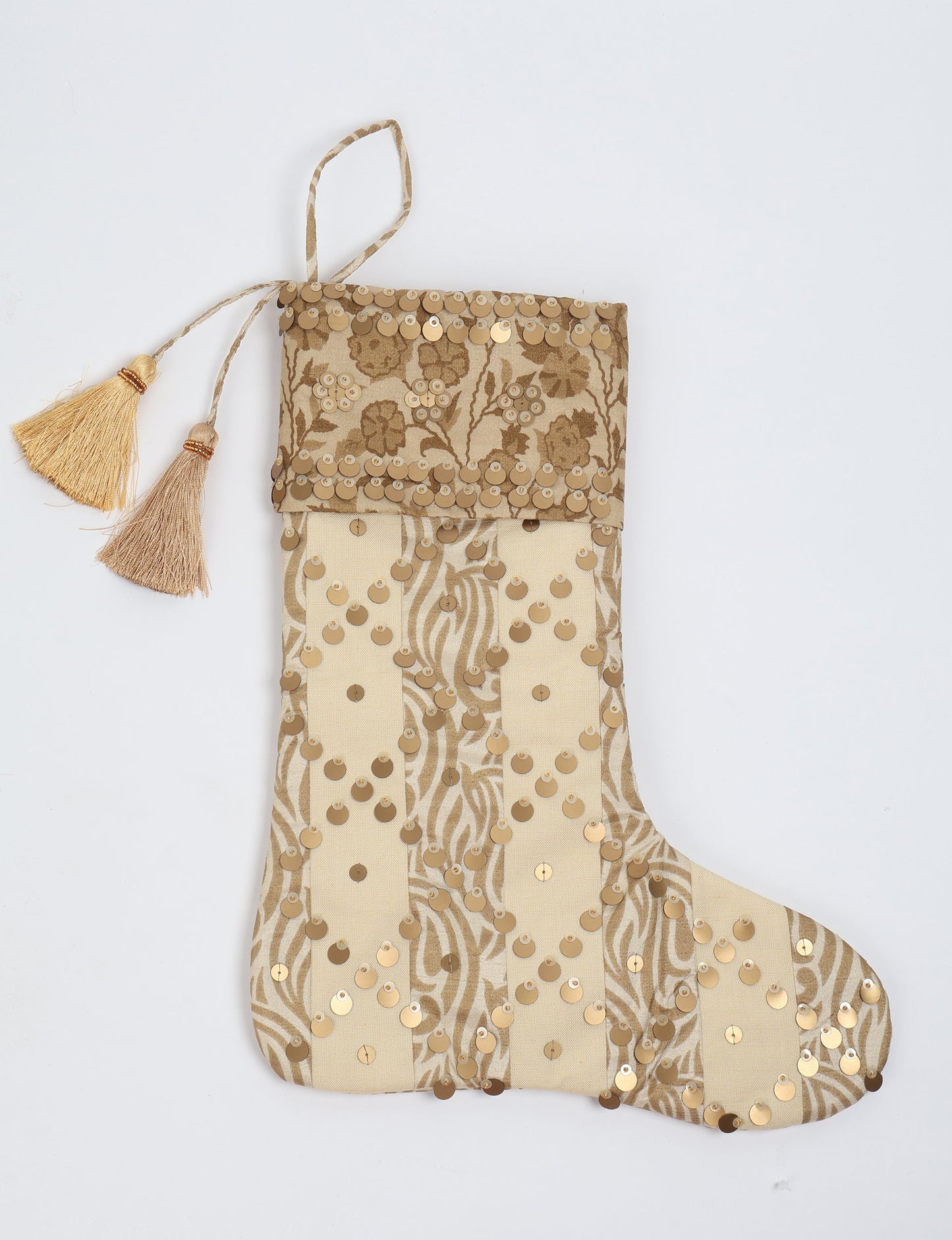 Upcycled sari Christmas stocking in ivory and cream tones with striped cotton detailing and gold embroidery; handmade eco clothing piece representing conscious clothing, recycled fashion, sustainable apparel, and fair trade fashion craftsmanship.