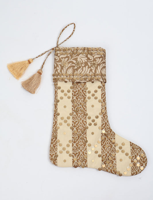 Upcycled sari Christmas stocking in ivory and cream tones with striped cotton detailing and gold embroidery; handmade eco clothing piece representing conscious clothing, recycled fashion, sustainable apparel, and fair trade fashion craftsmanship.