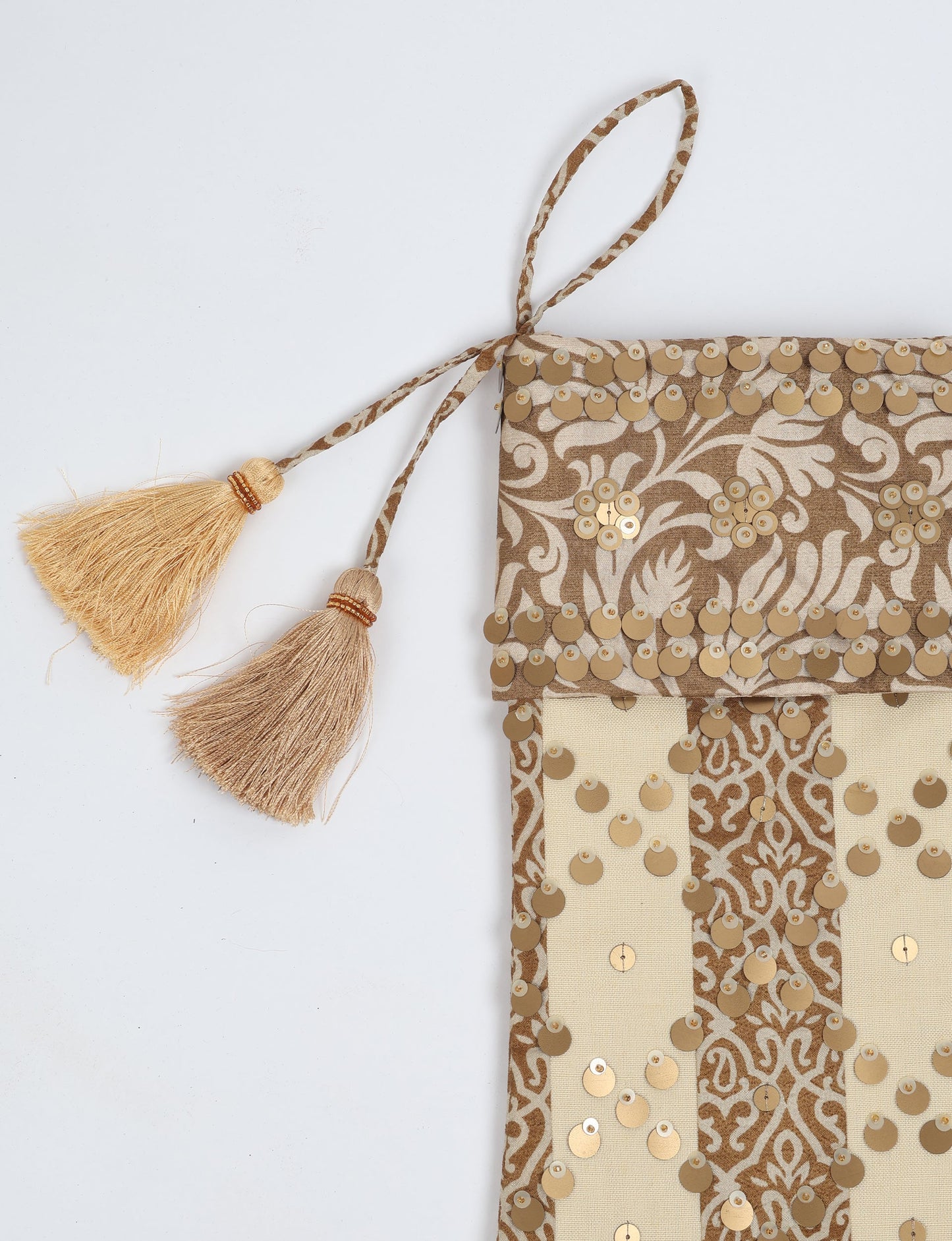 Upcycled sari Christmas stocking in ivory and cream tones with striped cotton detailing and gold embroidery; handmade eco clothing piece representing conscious clothing, recycled fashion, sustainable apparel, and fair trade fashion craftsmanship.