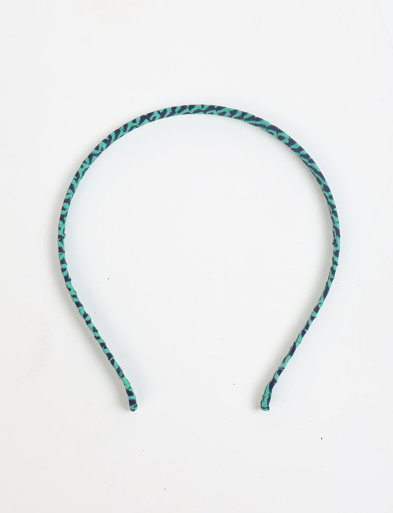 Thin fabric-wrapped metal hairband for a clean and stylish everyday look