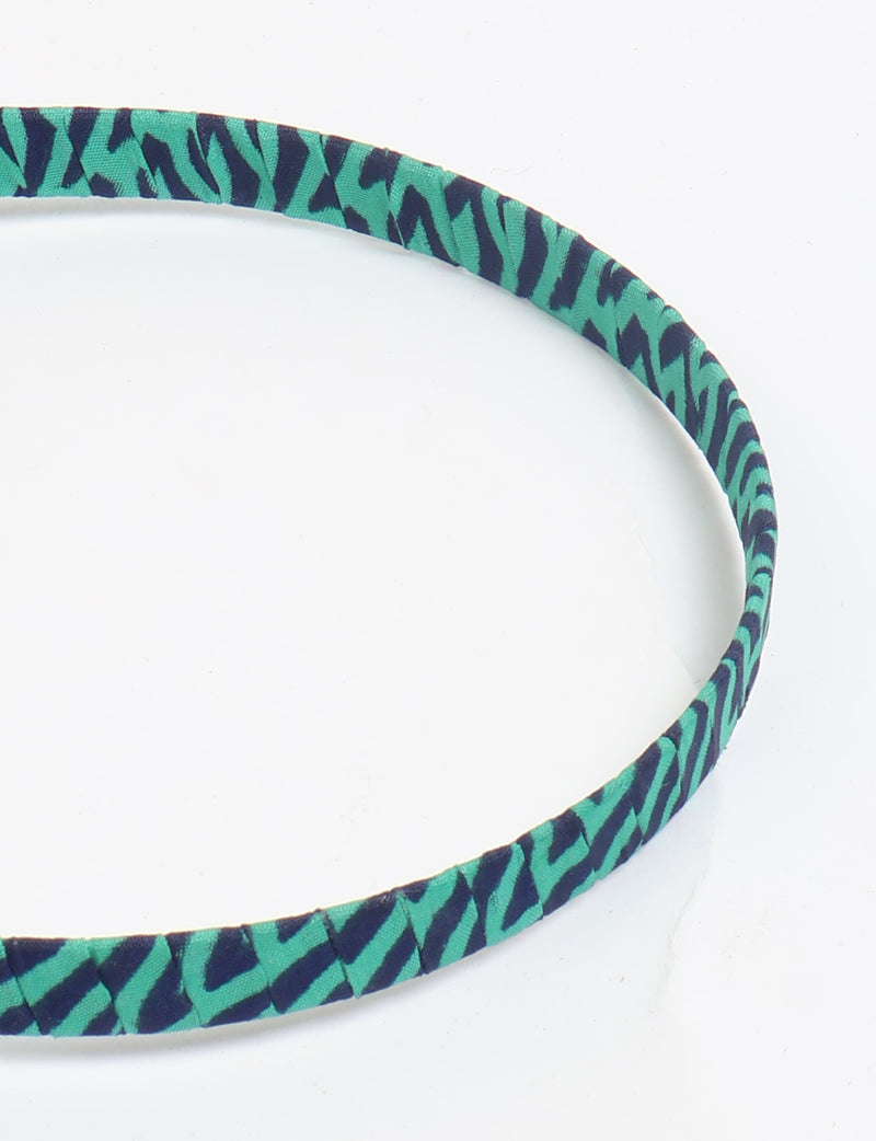 Thin fabric-wrapped metal hairband for a clean and stylish everyday look