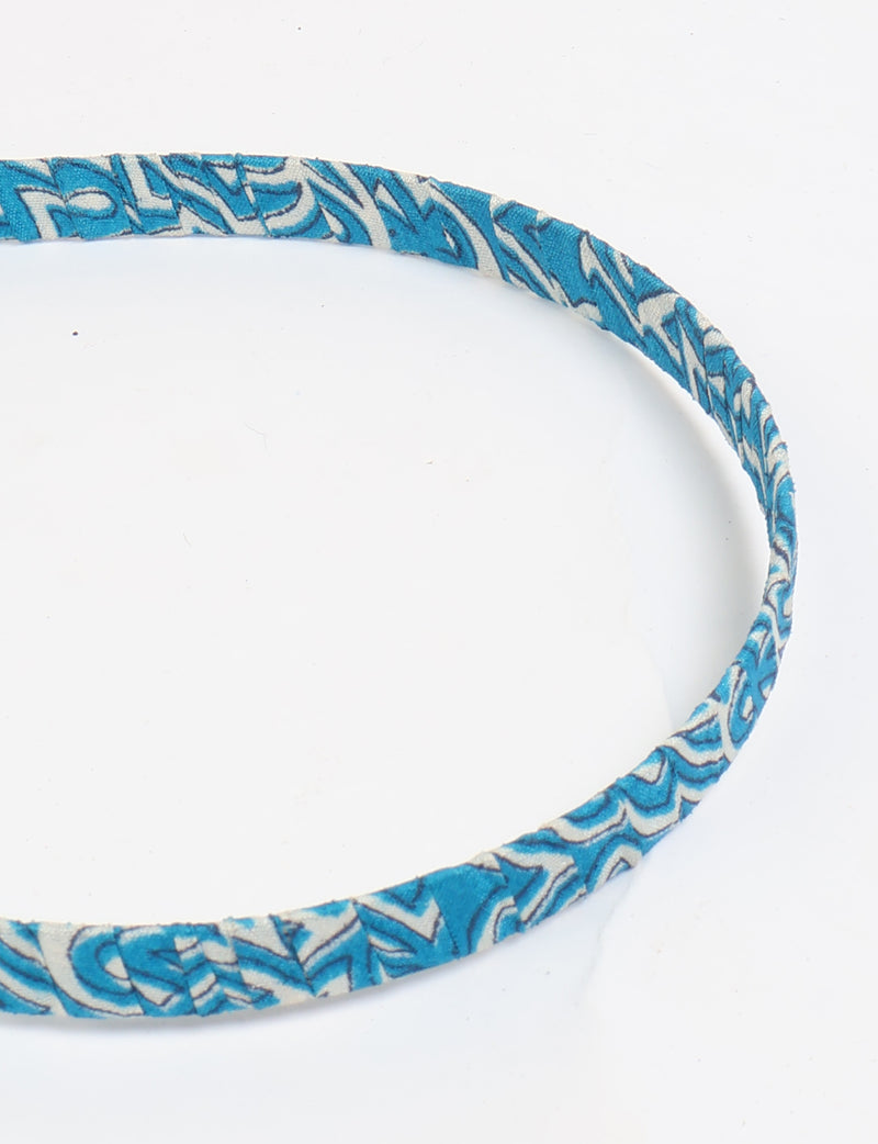 Thin fabric-wrapped metal hairband for a clean and stylish everyday look