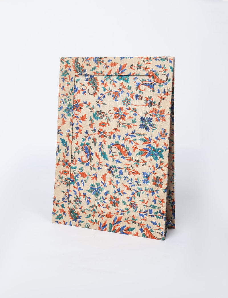 Brown tropical patterned fabric photo frame for A4 size, standing upright on a white background
