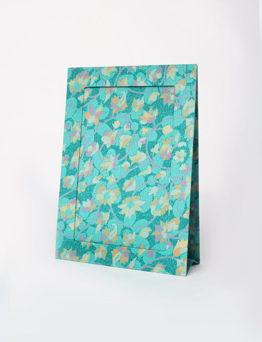 A4 size fabric photo frame with fold-out stand, made using upcycled clothing and recycled fashion concepts. Ideal for showcasing pictures, this eco friendly cloth-inspired frame highlights conscious clothing, zero waste clothing, and the essence of slow fashion.