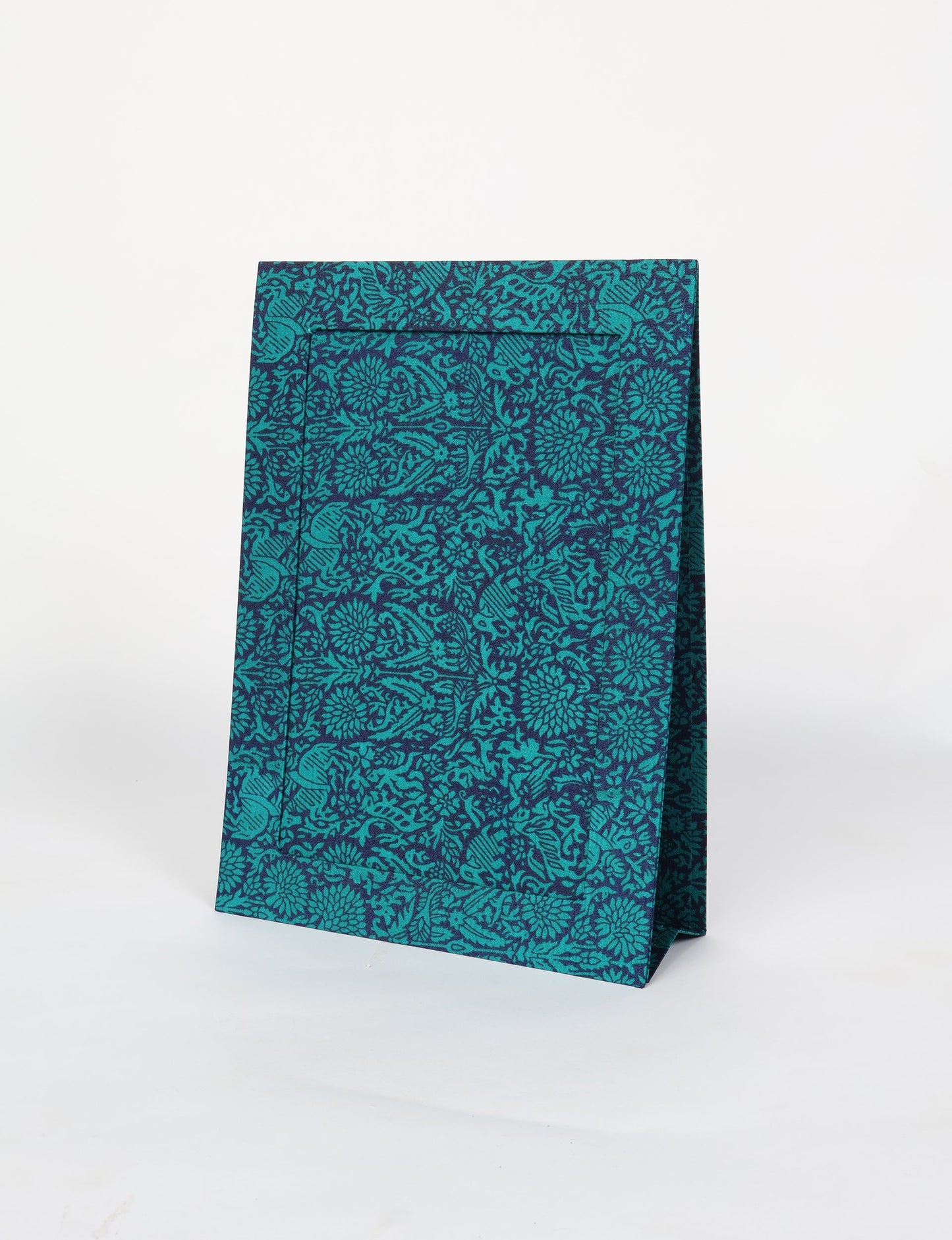 A4 size fabric photo frame with fold-out stand, made using upcycled clothing and recycled fashion concepts. Ideal for showcasing pictures, this eco friendly cloth-inspired frame highlights conscious clothing, zero waste clothing, and the essence of slow fashion.