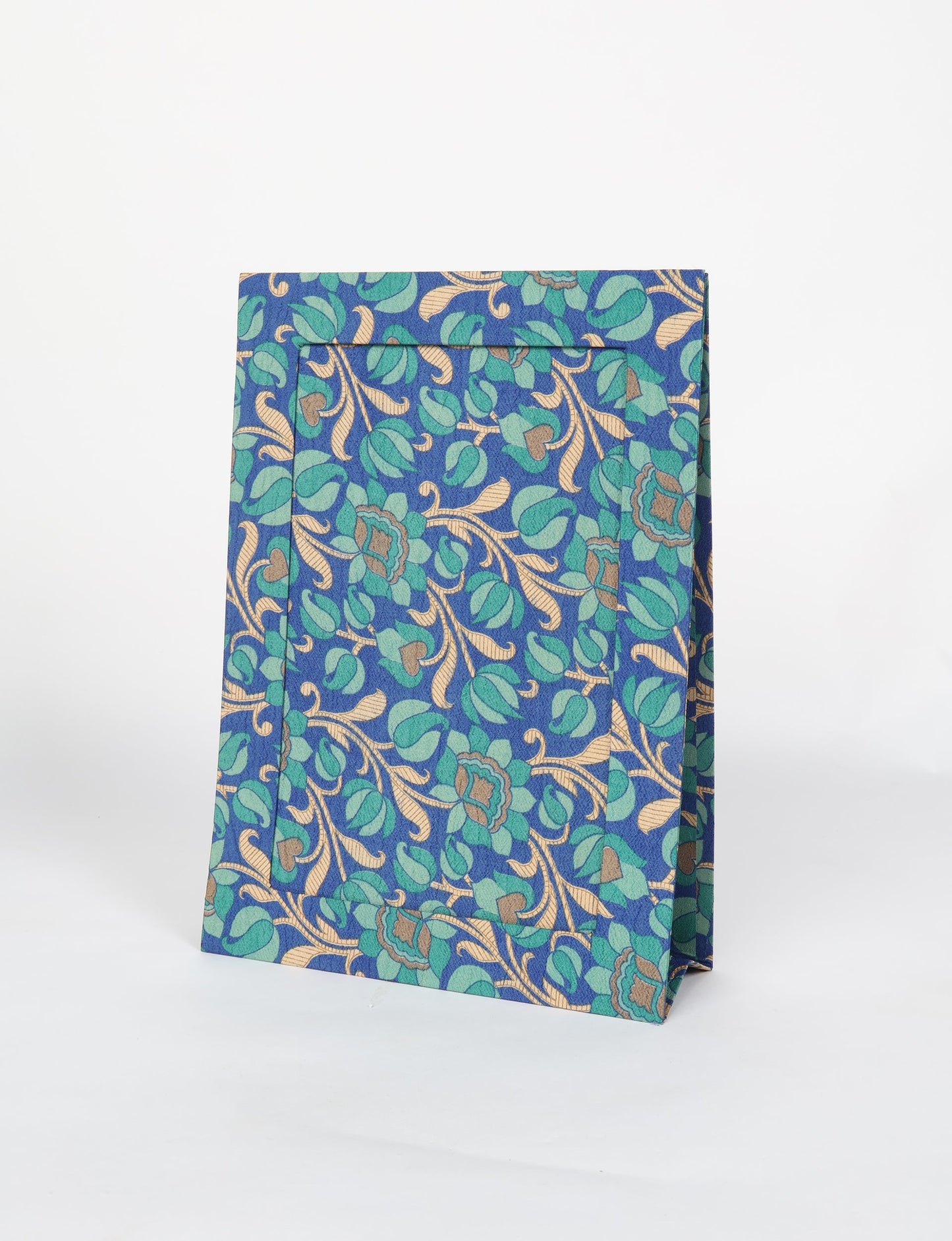 A4 size fabric photo frame with fold-out stand, made using upcycled clothing and recycled fashion concepts. Ideal for showcasing pictures, this eco friendly cloth-inspired frame highlights conscious clothing, zero waste clothing, and the essence of slow fashion.