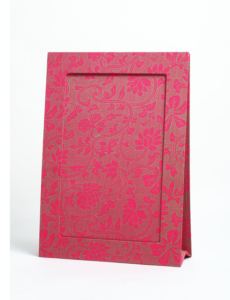 Pink tropical patterned fabric photo frame for A4 size photos, standing upright on a white background