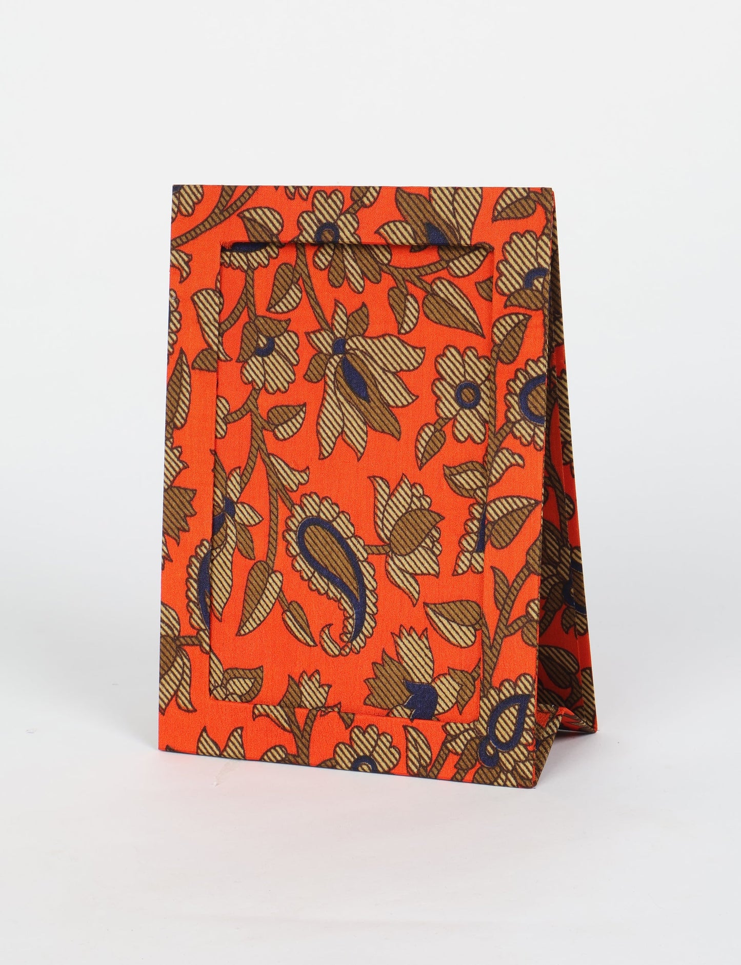 A5 rectangular fabric-covered tabletop photo frame with fold-out stand, created using upcycled clothing and repurposed clothing techniques. An eco friendly product inspired by zero waste clothing, fair trade fashion, and environmentally friendly clothing ideals, perfect for displaying photos or posters.