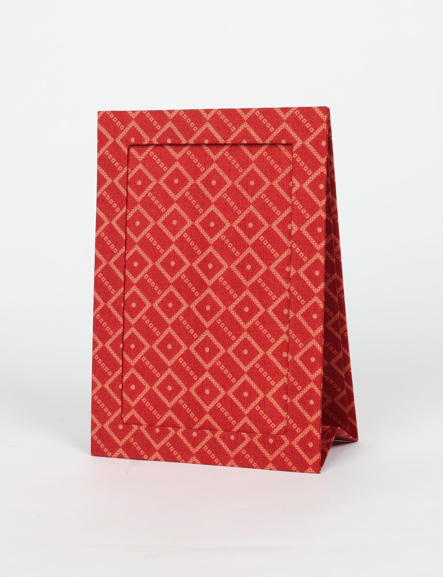 A5 rectangular fabric-covered tabletop photo frame with fold-out stand, created using upcycled clothing and repurposed clothing techniques. An eco friendly product inspired by zero waste clothing, fair trade fashion, and environmentally friendly clothing ideals, perfect for displaying photos or posters.