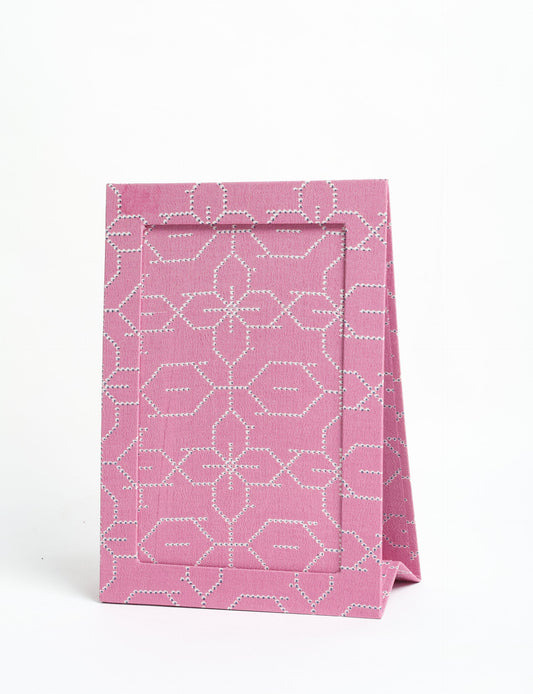 A5 rectangular fabric-covered tabletop photo frame with fold-out stand, created using upcycled clothing and repurposed clothing techniques. An eco friendly product inspired by zero waste clothing, fair trade fashion, and environmentally friendly clothing ideals, perfect for displaying photos or posters.