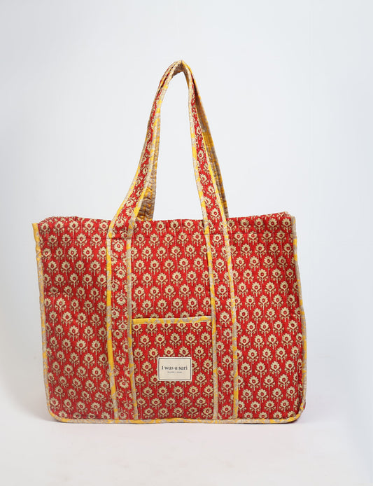 Quilted work tote bag with structured rectangular design and long shoulder straps, representing slow fashion and ethical clothing ideals, made as part of upcycled women's clothing and sustainable women's clothing using recycled fashion and earth friendly clothing practices.
