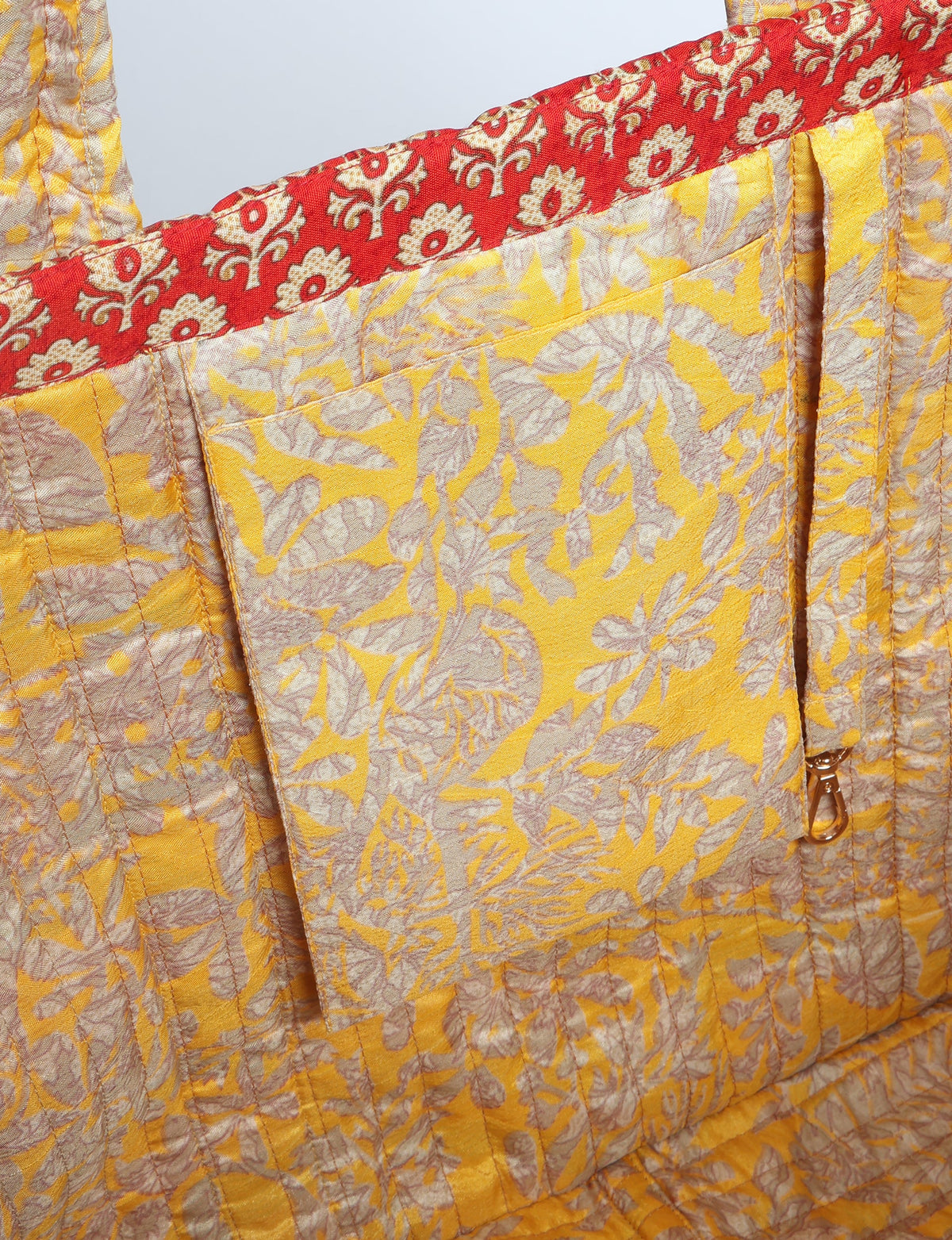 Quilted work tote bag with structured rectangular design and long shoulder straps, representing slow fashion and ethical clothing ideals, made as part of upcycled women's clothing and sustainable women's clothing using recycled fashion and earth friendly clothing practices.