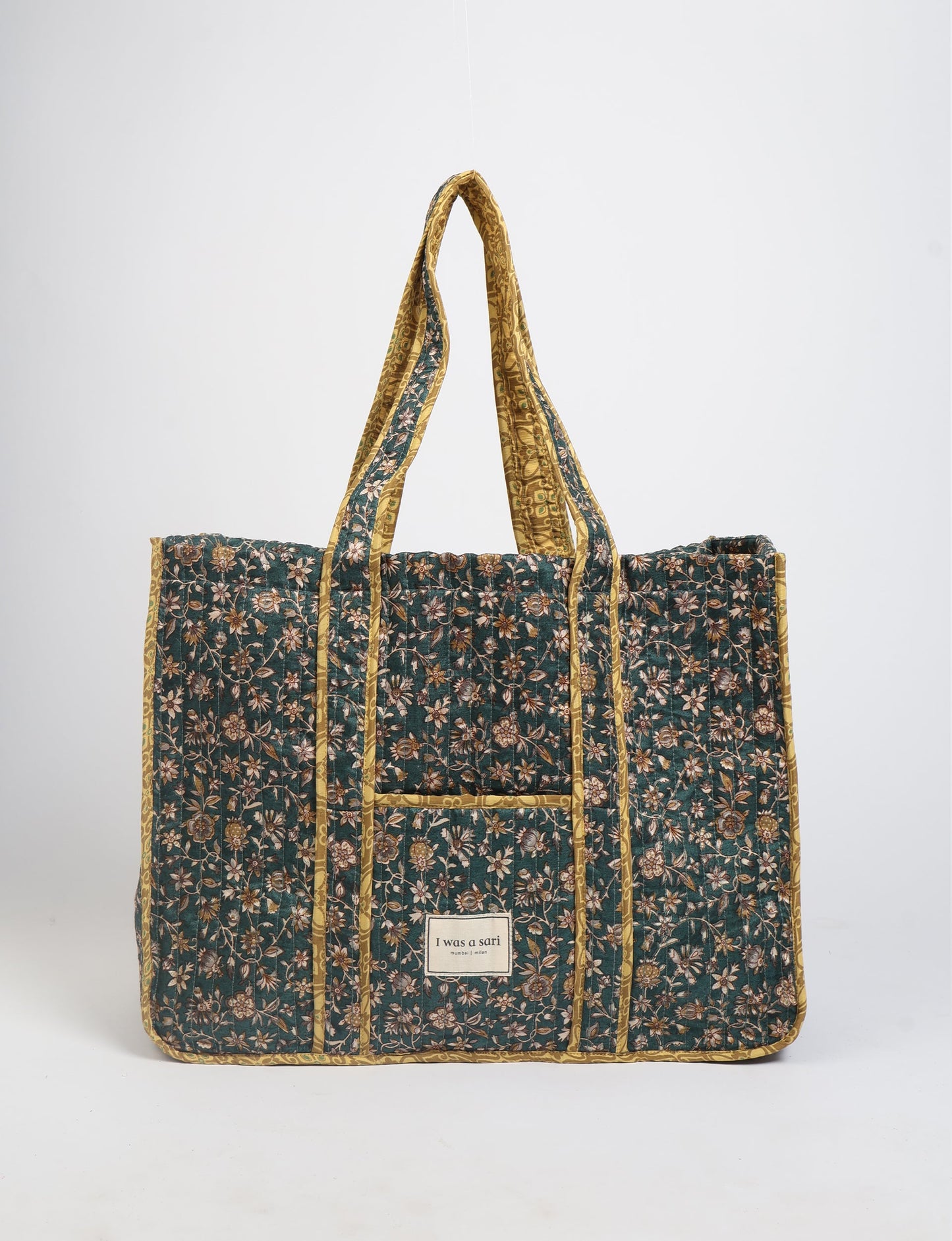 Quilted work tote bag with structured rectangular design and long shoulder straps, representing slow fashion and ethical clothing ideals, made as part of upcycled women's clothing and sustainable women's clothing using recycled fashion and earth friendly clothing practices.