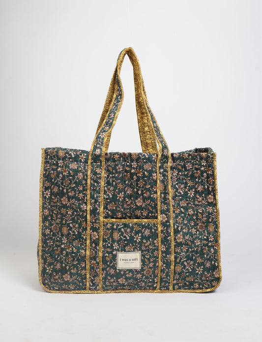 Quilted work tote bag with structured rectangular design and long shoulder straps, representing slow fashion and ethical clothing ideals, made as part of upcycled women's clothing and sustainable women's clothing using recycled fashion and earth friendly clothing practices.
