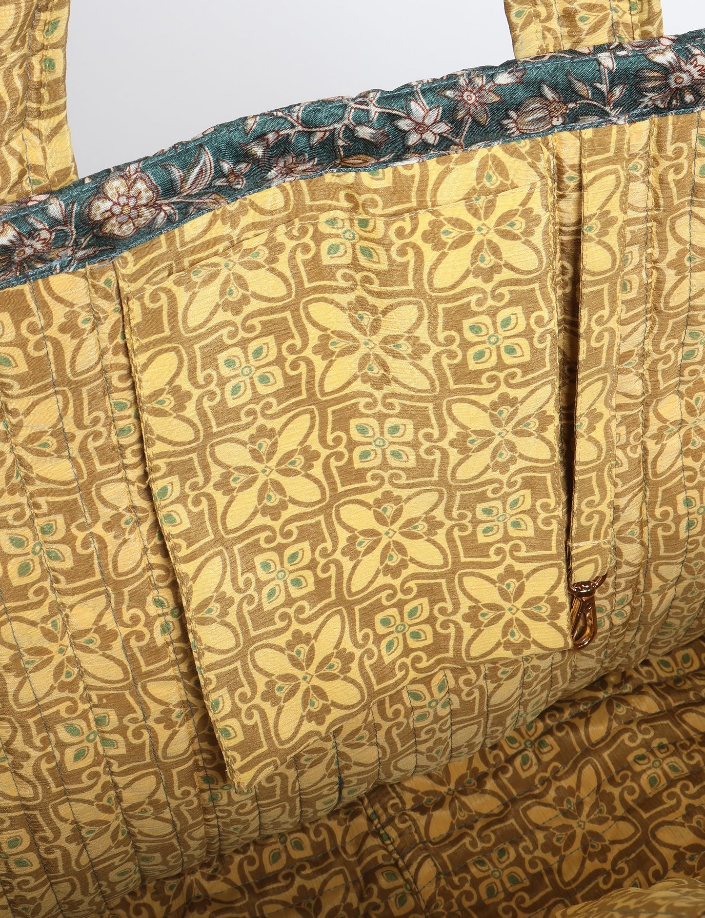 Quilted work tote bag with structured rectangular design and long shoulder straps, representing slow fashion and ethical clothing ideals, made as part of upcycled women's clothing and sustainable women's clothing using recycled fashion and earth friendly clothing practices.