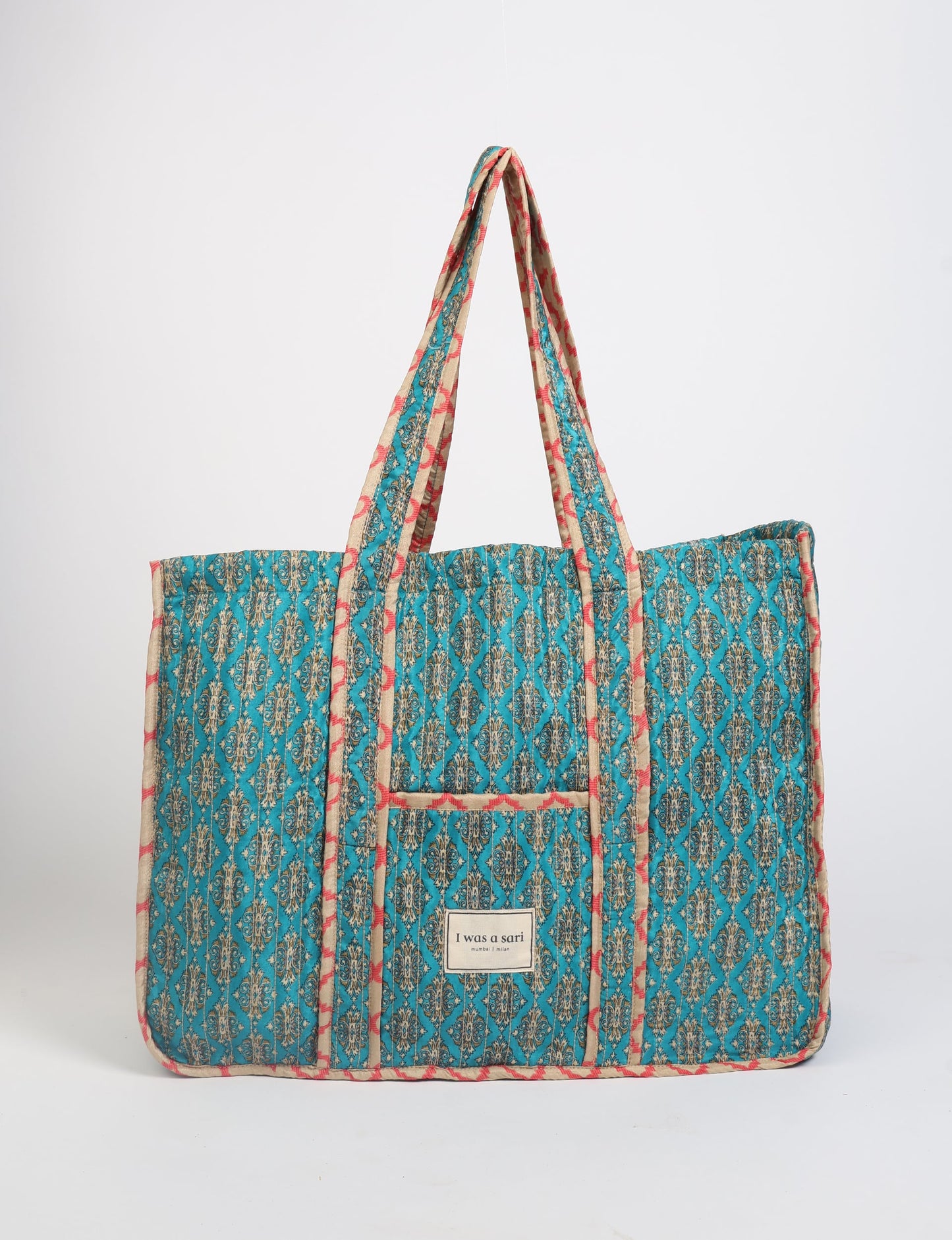 Quilted work tote bag with structured rectangular design and long shoulder straps, representing slow fashion and ethical clothing ideals, made as part of upcycled women's clothing and sustainable women's clothing using recycled fashion and earth friendly clothing practices.