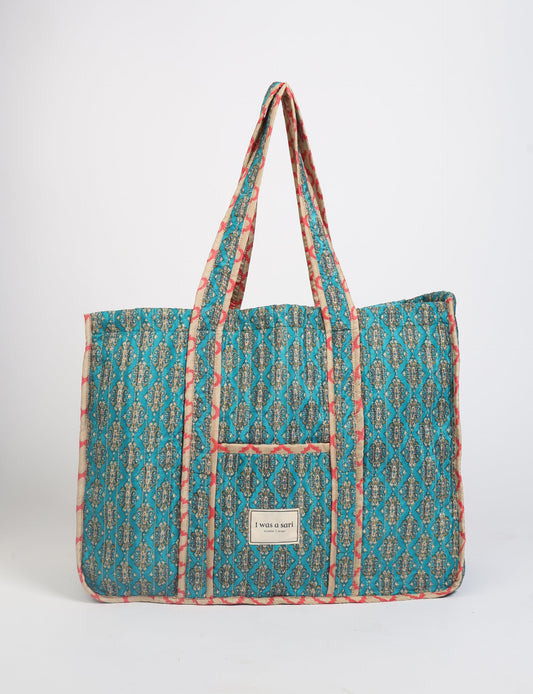 Quilted work tote bag with structured rectangular design and long shoulder straps, representing slow fashion and ethical clothing ideals, made as part of upcycled women's clothing and sustainable women's clothing using recycled fashion and earth friendly clothing practices.