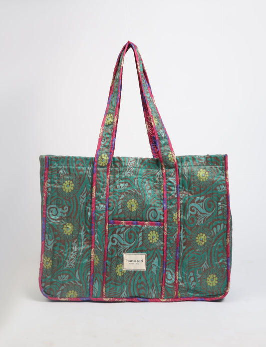 Quilted work tote bag with structured rectangular design and long shoulder straps, representing slow fashion and ethical clothing ideals, made as part of upcycled women's clothing and sustainable women's clothing using recycled fashion and earth friendly clothing practices.