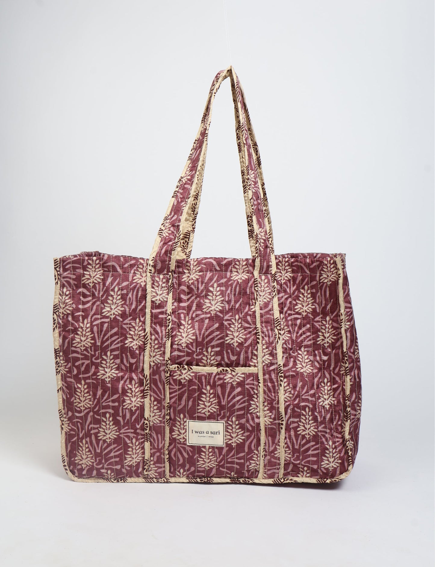 Quilted work tote bag with structured rectangular design and long shoulder straps, representing slow fashion and ethical clothing ideals, made as part of upcycled women's clothing and sustainable women's clothing using recycled fashion and earth friendly clothing practices.