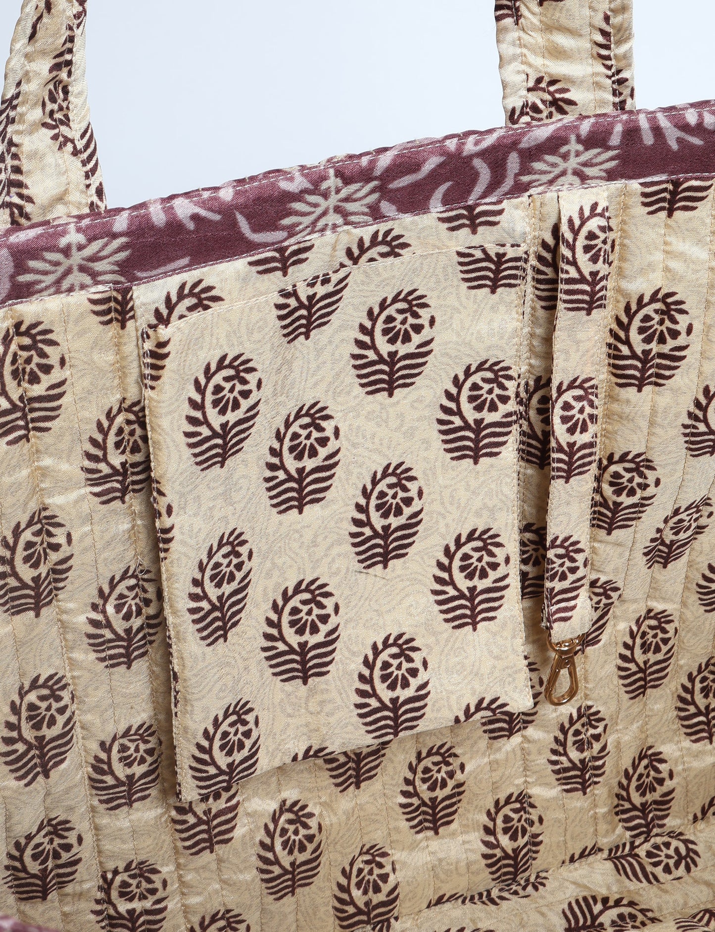 Quilted work tote bag with structured rectangular design and long shoulder straps, representing slow fashion and ethical clothing ideals, made as part of upcycled women's clothing and sustainable women's clothing using recycled fashion and earth friendly clothing practices.