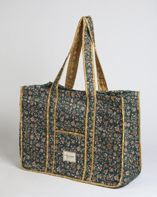 Quilted work tote bag with structured rectangular design and long shoulder straps, representing slow fashion and ethical clothing ideals, made as part of upcycled women's clothing and sustainable women's clothing using recycled fashion and earth friendly clothing practices.