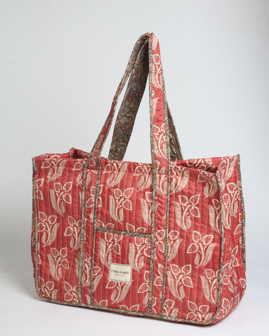 Quilted work tote bag with structured rectangular design and long shoulder straps, representing slow fashion and ethical clothing ideals, made as part of upcycled women's clothing and sustainable women's clothing using recycled fashion and earth friendly clothing practices.