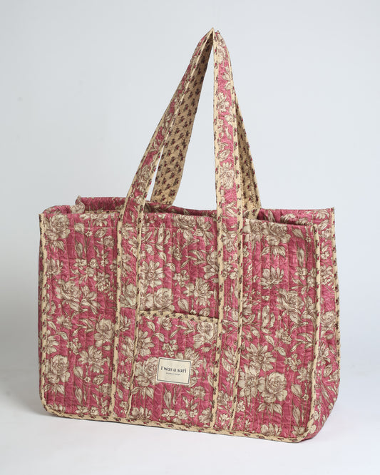 Quilted work tote bag with structured rectangular design and long shoulder straps, representing slow fashion and ethical clothing ideals, made as part of upcycled women's clothing and sustainable women's clothing using recycled fashion and earth friendly clothing practices.
