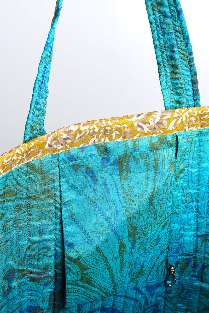 Quilted work tote bag with structured rectangular design and long shoulder straps, representing slow fashion and ethical clothing ideals, made as part of upcycled women's clothing and sustainable women's clothing using recycled fashion and earth friendly clothing practices.