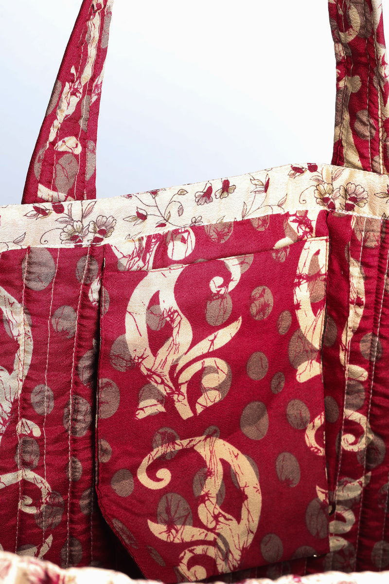 Quilted work tote bag with structured rectangular design and long shoulder straps, representing slow fashion and ethical clothing ideals, made as part of upcycled women's clothing and sustainable women's clothing using recycled fashion and earth friendly clothing practices.