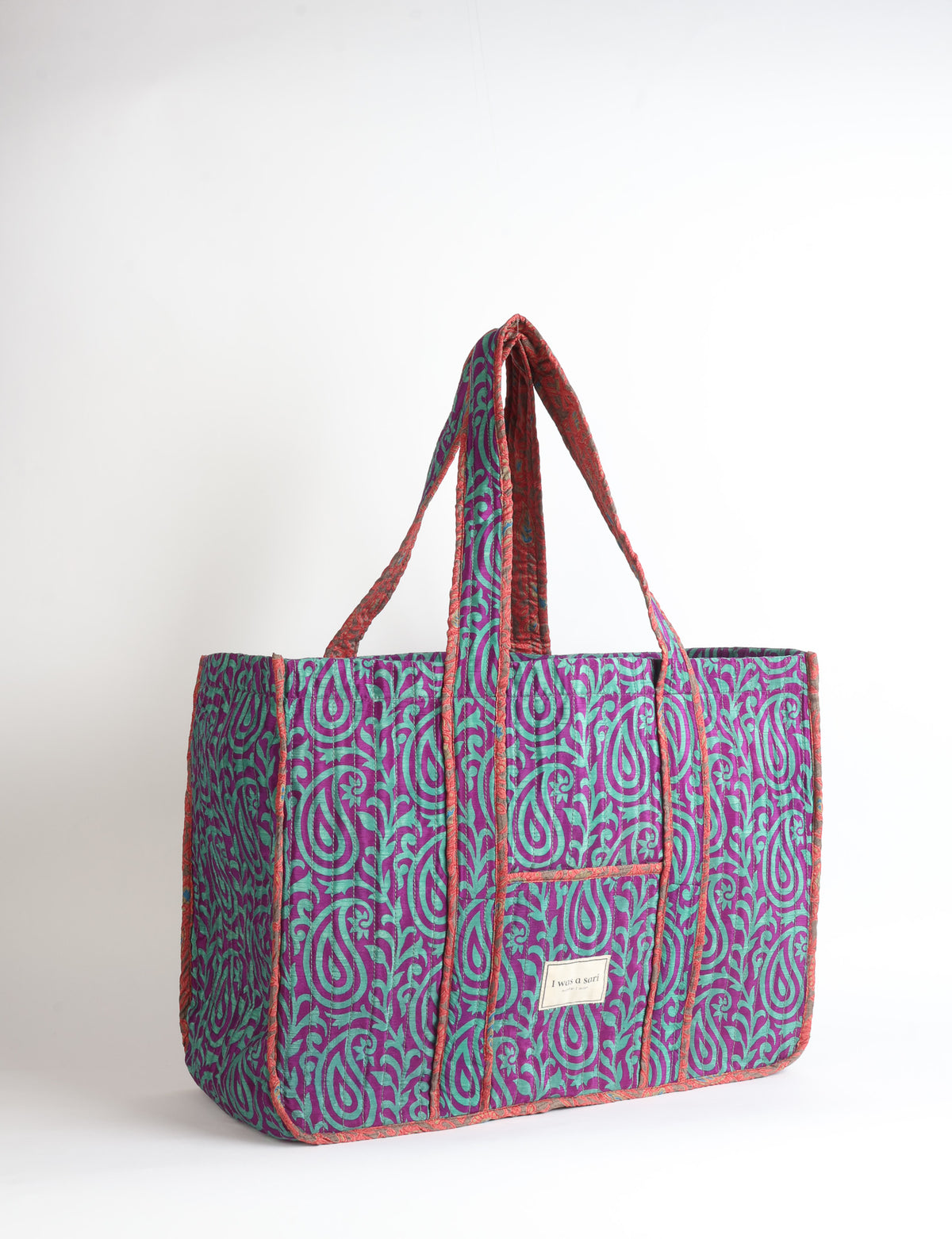 Quilted work tote bag with structured rectangular design and long shoulder straps, representing slow fashion and ethical clothing ideals, made as part of upcycled women's clothing and sustainable women's clothing using recycled fashion and earth friendly clothing practices.