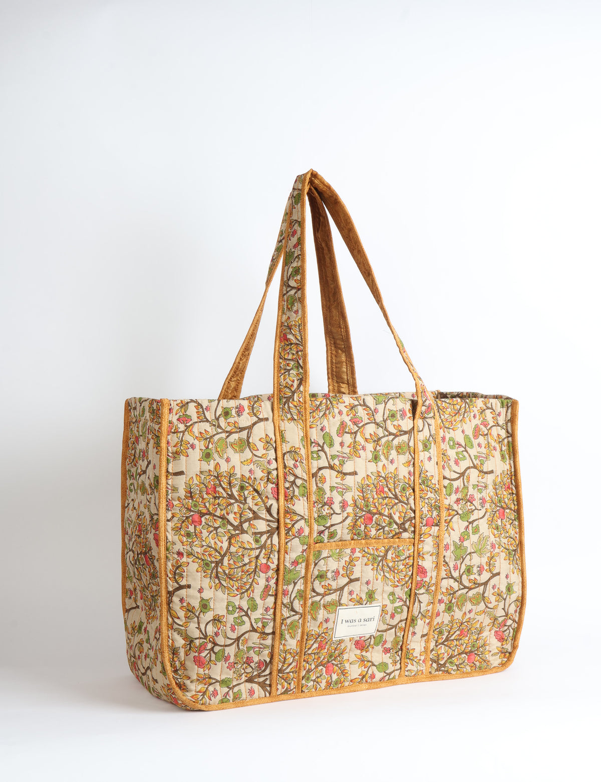 Quilted work tote bag with structured rectangular design and long shoulder straps, representing slow fashion and ethical clothing ideals, made as part of upcycled women's clothing and sustainable women's clothing using recycled fashion and earth friendly clothing practices.