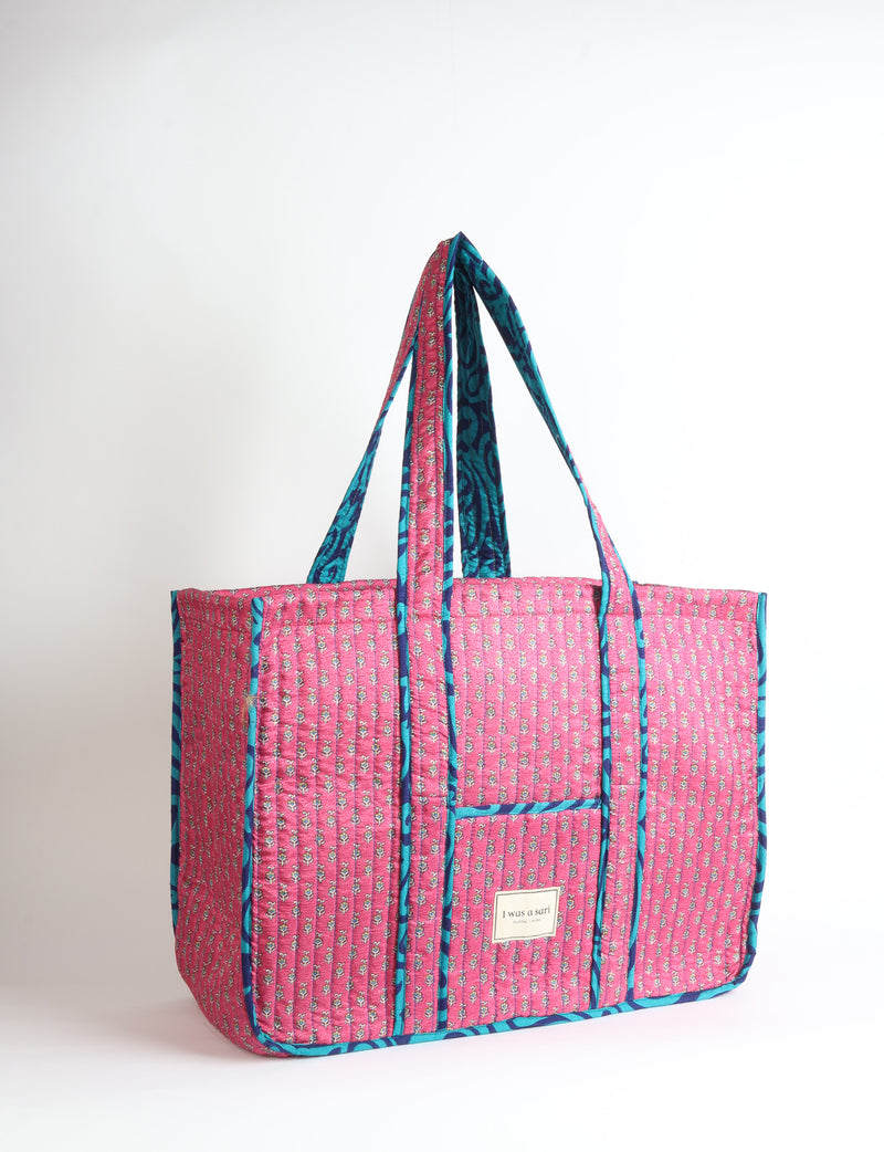 Quilted work tote bag with structured rectangular design and long shoulder straps, representing slow fashion and ethical clothing ideals, made as part of upcycled women's clothing and sustainable women's clothing using recycled fashion and earth friendly clothing practices.