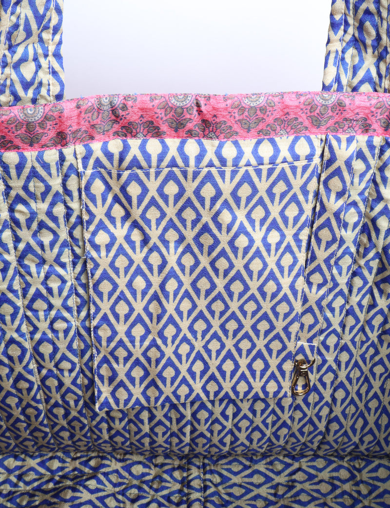 Quilted work tote bag with structured rectangular design and long shoulder straps, representing slow fashion and ethical clothing ideals, made as part of upcycled women's clothing and sustainable women's clothing using recycled fashion and earth friendly clothing practices.