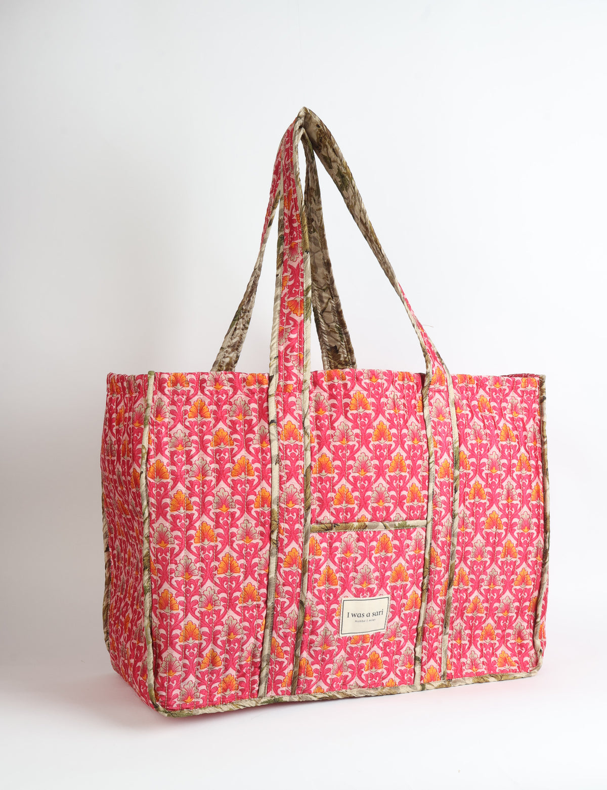Quilted work tote bag with structured rectangular design and long shoulder straps, representing slow fashion and ethical clothing ideals, made as part of upcycled women's clothing and sustainable women's clothing using recycled fashion and earth friendly clothing practices.