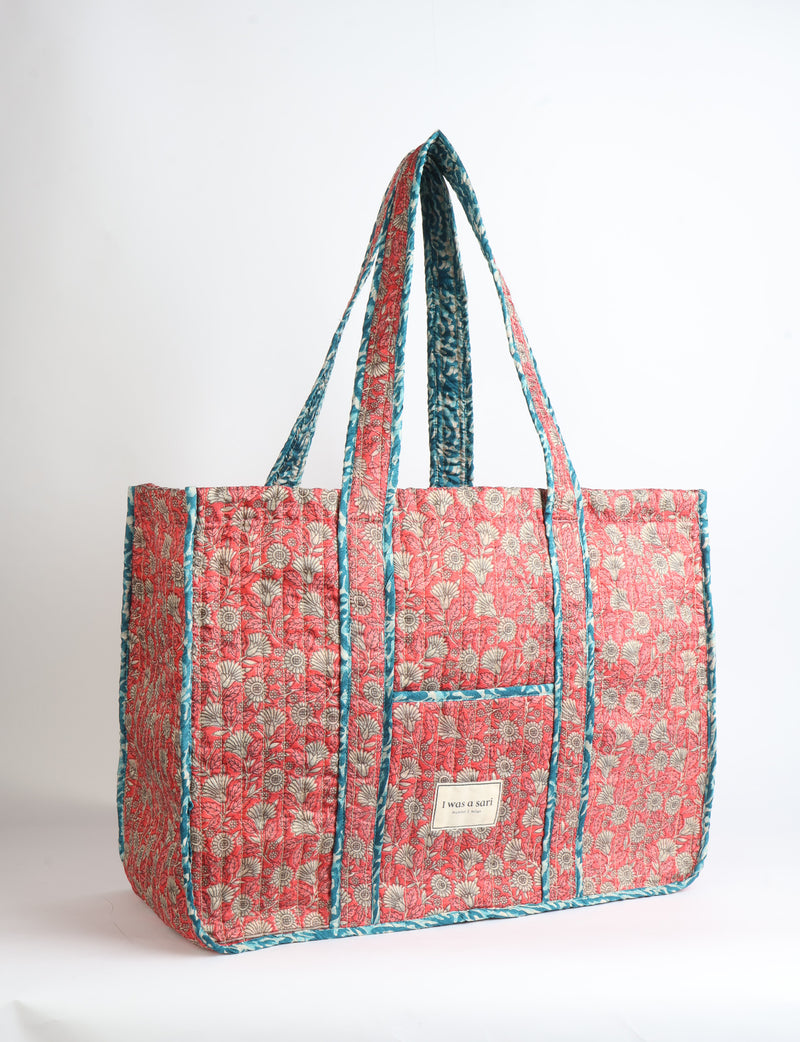 Quilted work tote bag with structured rectangular design and long shoulder straps, representing slow fashion and ethical clothing ideals, made as part of upcycled women's clothing and sustainable women's clothing using recycled fashion and earth friendly clothing practices.