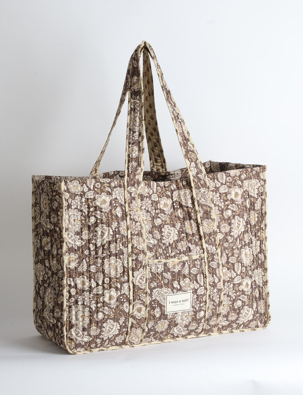 Quilted work tote bag with structured rectangular design and long shoulder straps, representing slow fashion and ethical clothing ideals, made as part of upcycled women's clothing and sustainable women's clothing using recycled fashion and earth friendly clothing practices.