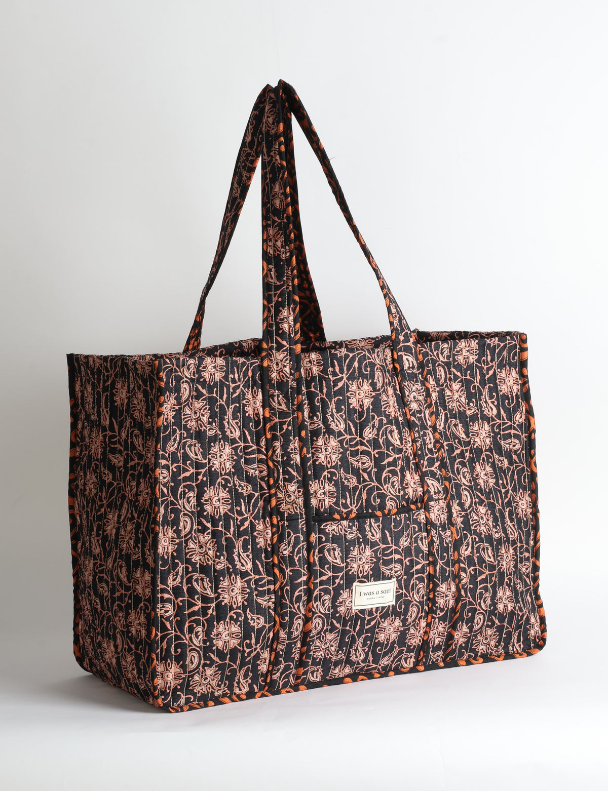 Quilted work tote bag with structured rectangular design and long shoulder straps, representing slow fashion and ethical clothing ideals, made as part of upcycled women's clothing and sustainable women's clothing using recycled fashion and earth friendly clothing practices.