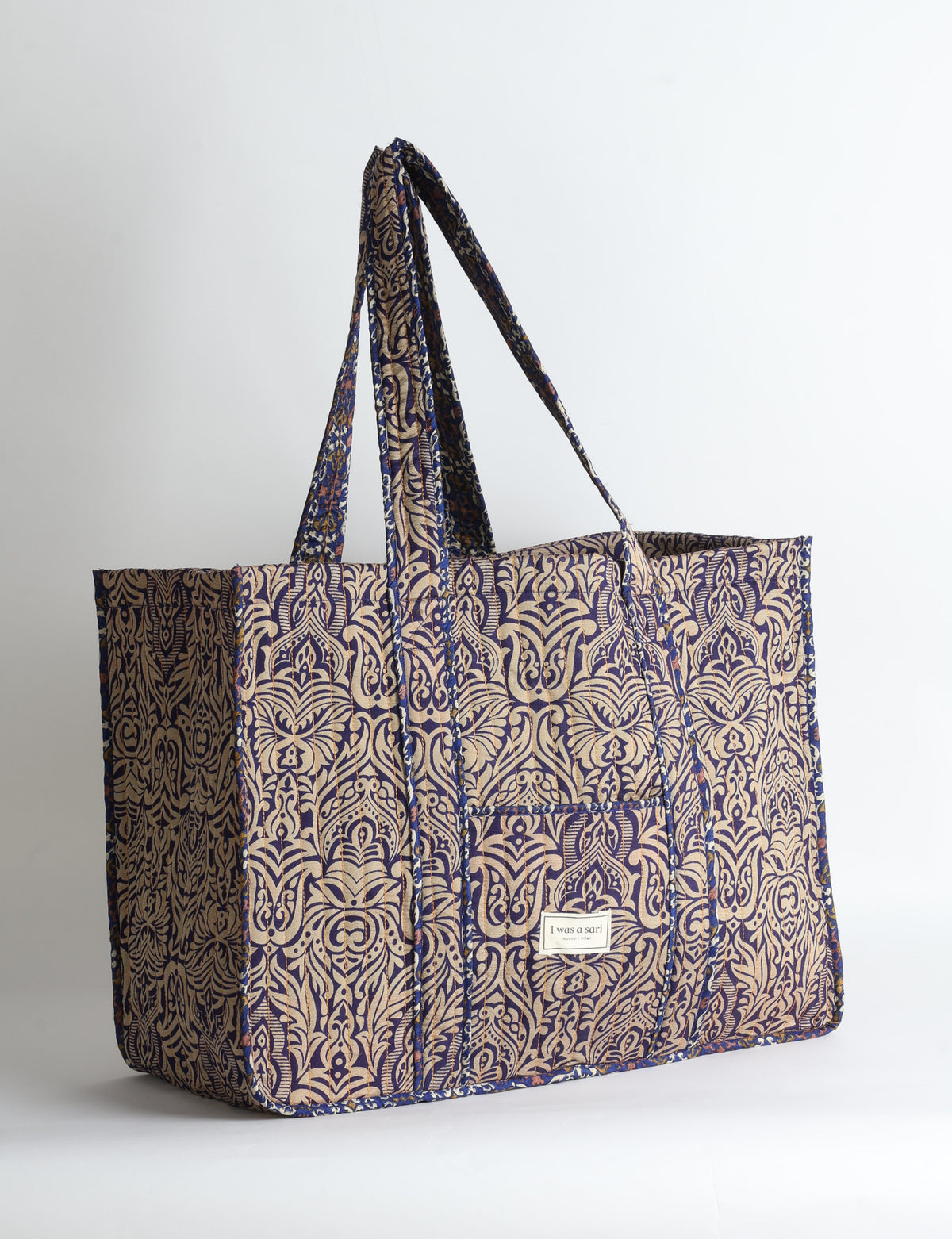 Quilted work tote bag with structured rectangular design and long shoulder straps, representing slow fashion and ethical clothing ideals, made as part of upcycled women's clothing and sustainable women's clothing using recycled fashion and earth friendly clothing practices.
