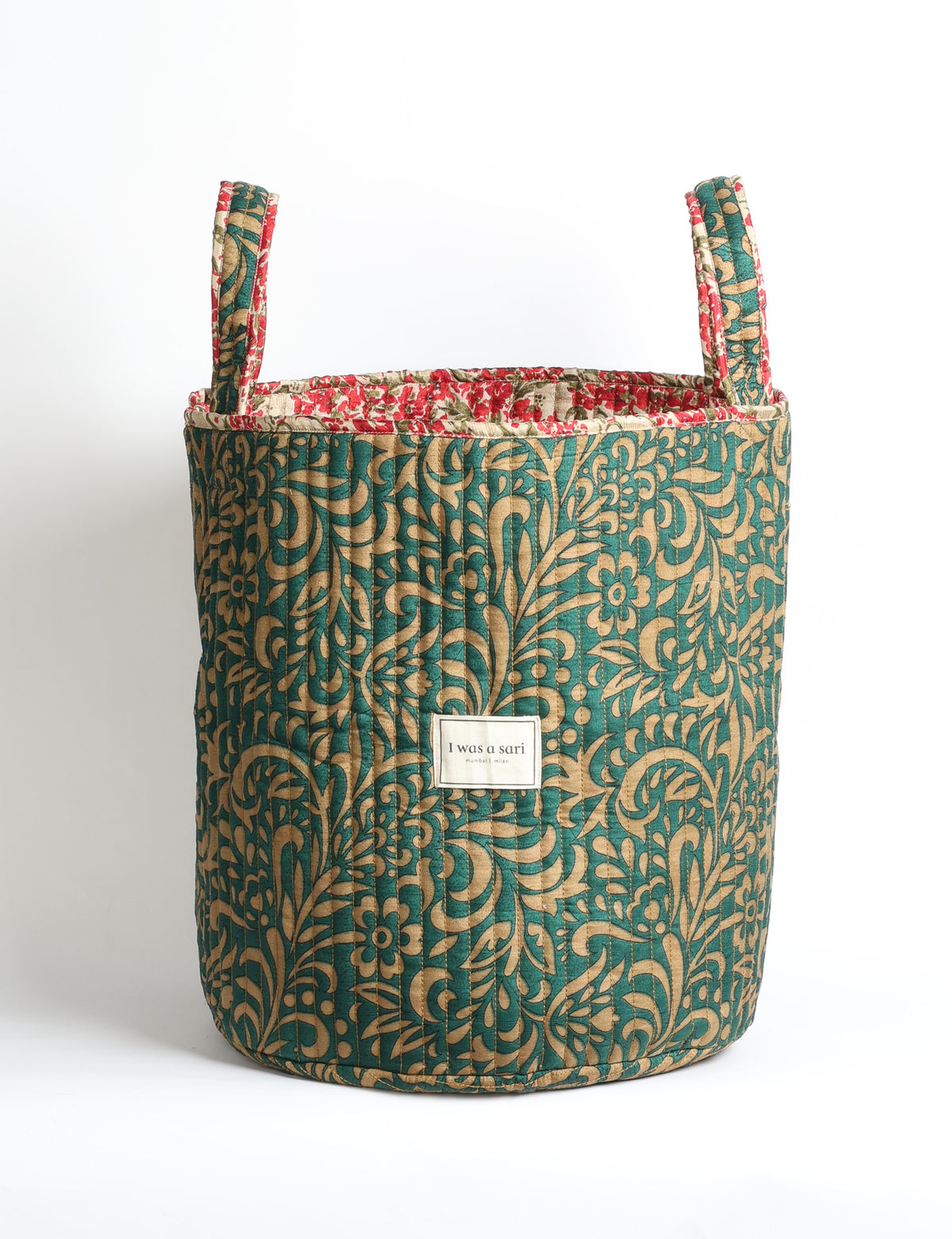 Quilted storage basket with handle in a soft cylindrical design, available in small and medium sizes for home organization.