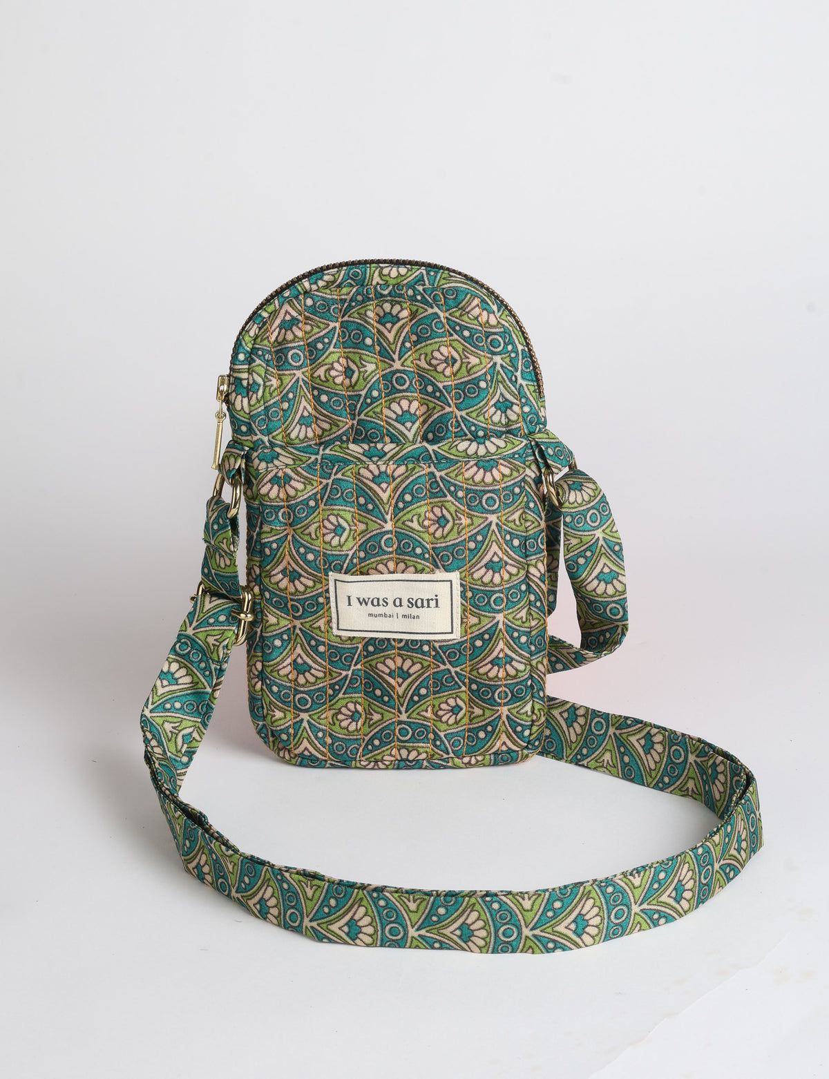 Compact quilted mobile bag featuring a padded rectangular silhouette, secure zip-top closure and adjustable crossbody strap for everyday use.