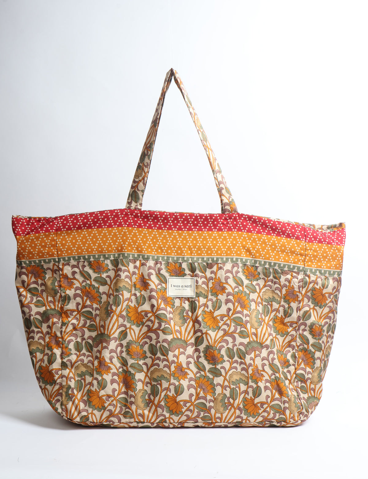 Large beach bag with a spacious rectangular design, wide top opening, and comfortable shoulder handles for carrying daily and travel essentials.