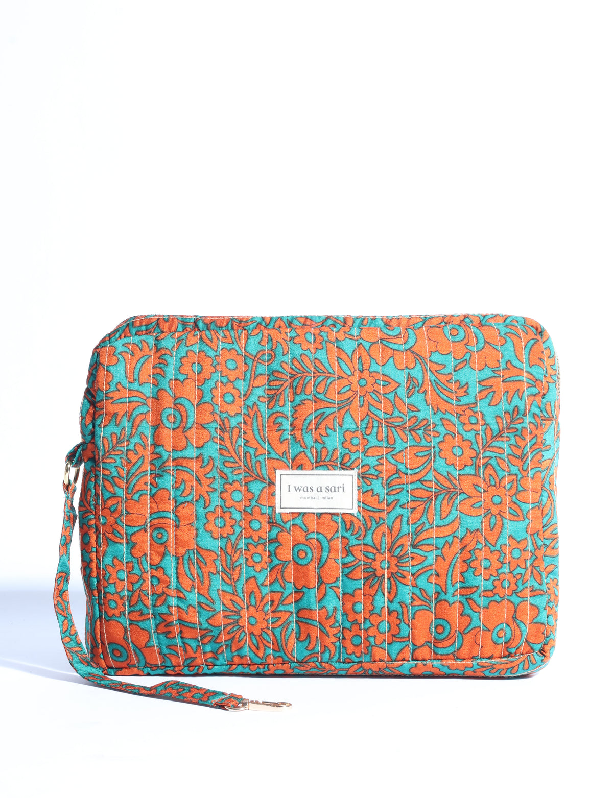 Quilted organizer with orange floral pattern on teal background, rectangular shape, wrist strap, and "I was a sari" label