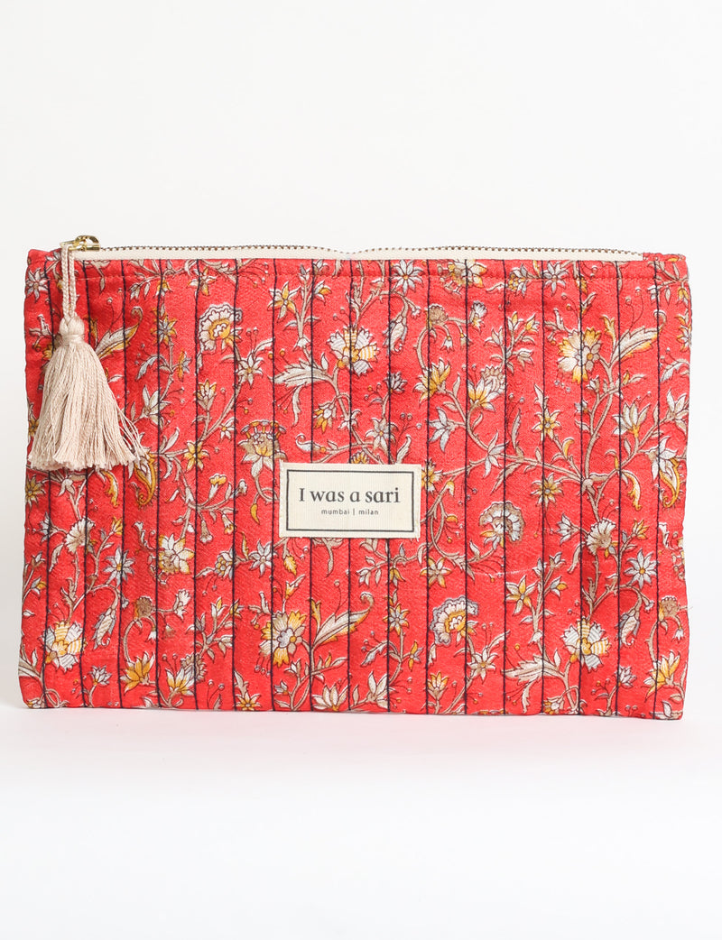 Quilted zipper pouch with tassel trim, available in three sizes for organising everyday essentials.