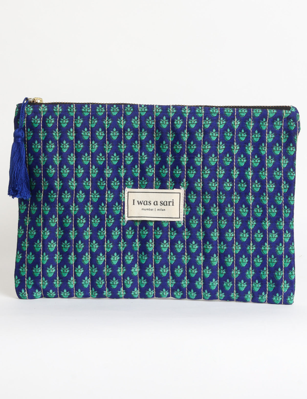 Quilted zipper pouch with tassel trim, available in three sizes for organising everyday essentials.