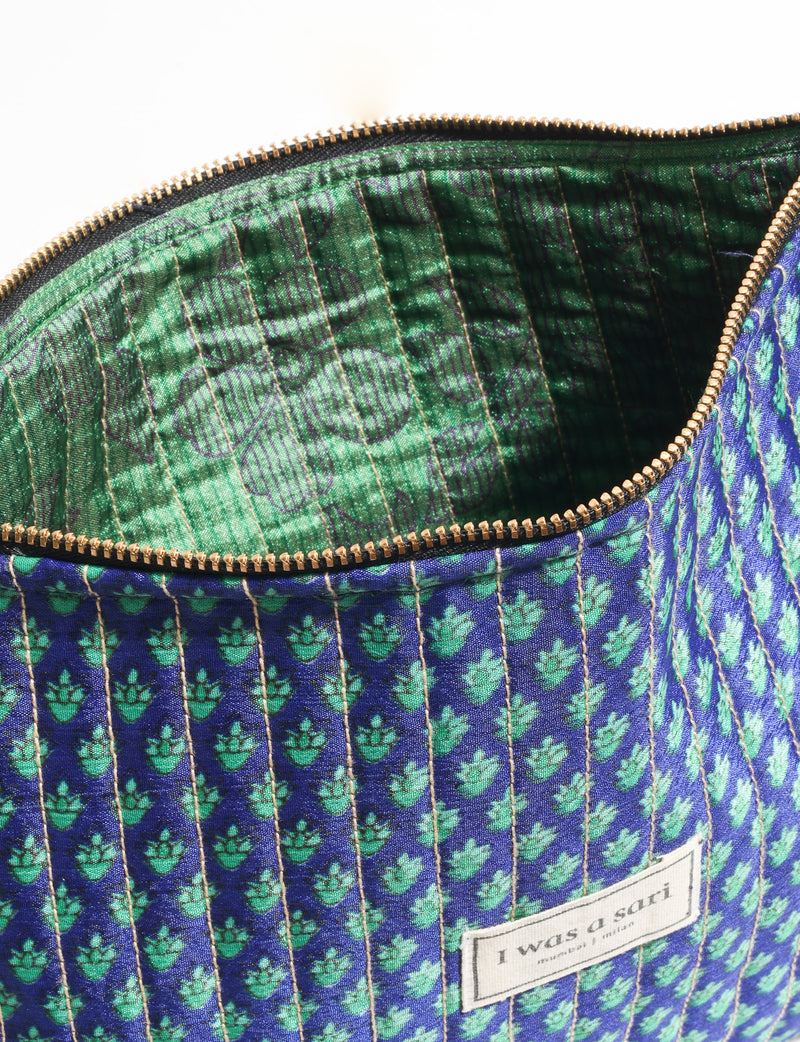 Quilted zipper pouch with tassel trim, available in three sizes for organising everyday essentials.
