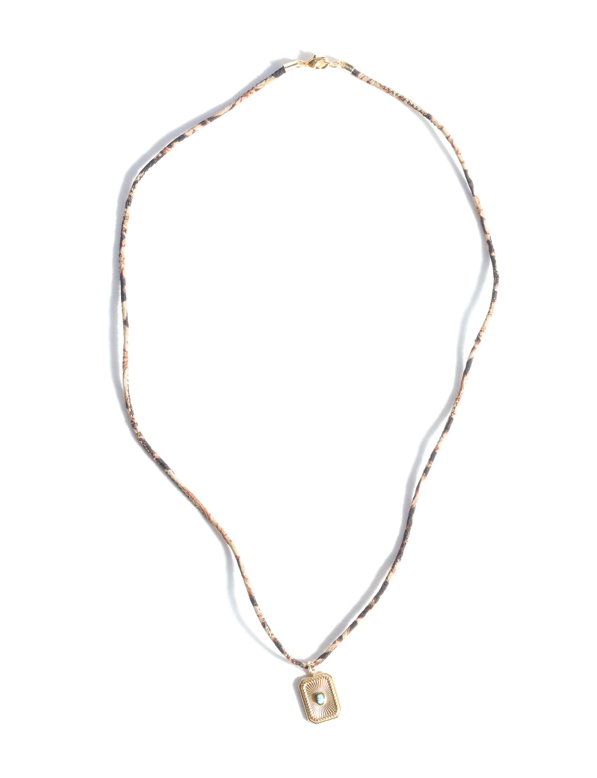 Adjustable cord necklace with gold-plated metal pendant inspired by upcycled women’s clothing, sustainable women’s clothing, eco friendly fashion, recycled sustainable fashion, carbon neutral fashion, and environment friendly clothing principles.