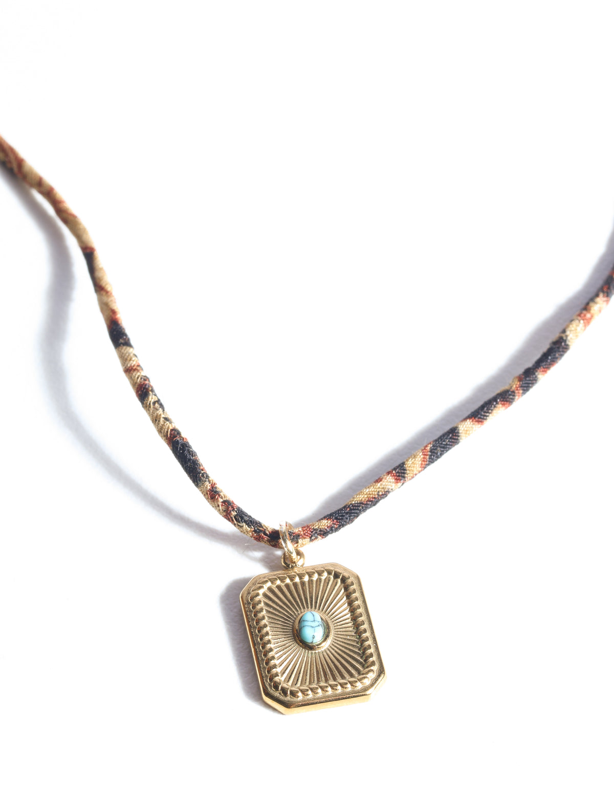 Adjustable cord necklace with gold-plated metal pendant inspired by upcycled women’s clothing, sustainable women’s clothing, eco friendly fashion, recycled sustainable fashion, carbon neutral fashion, and environment friendly clothing principles.