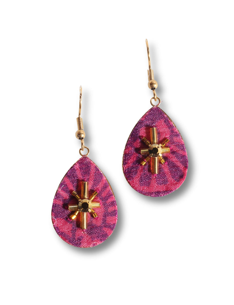 Pink and purple abstract teardrop earrings with gold-tone beaded cross design and gold hooks, front view on white background