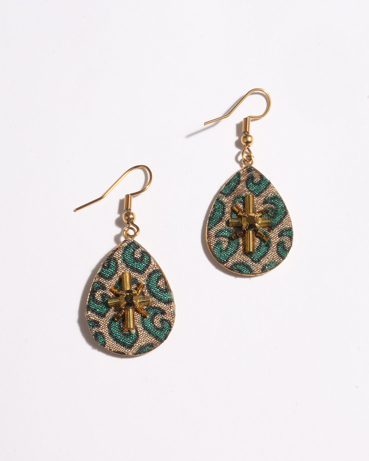 Gold-tone teardrop earrings with green micro pattern fabric and central gold bead embellishment, shown flat on white background