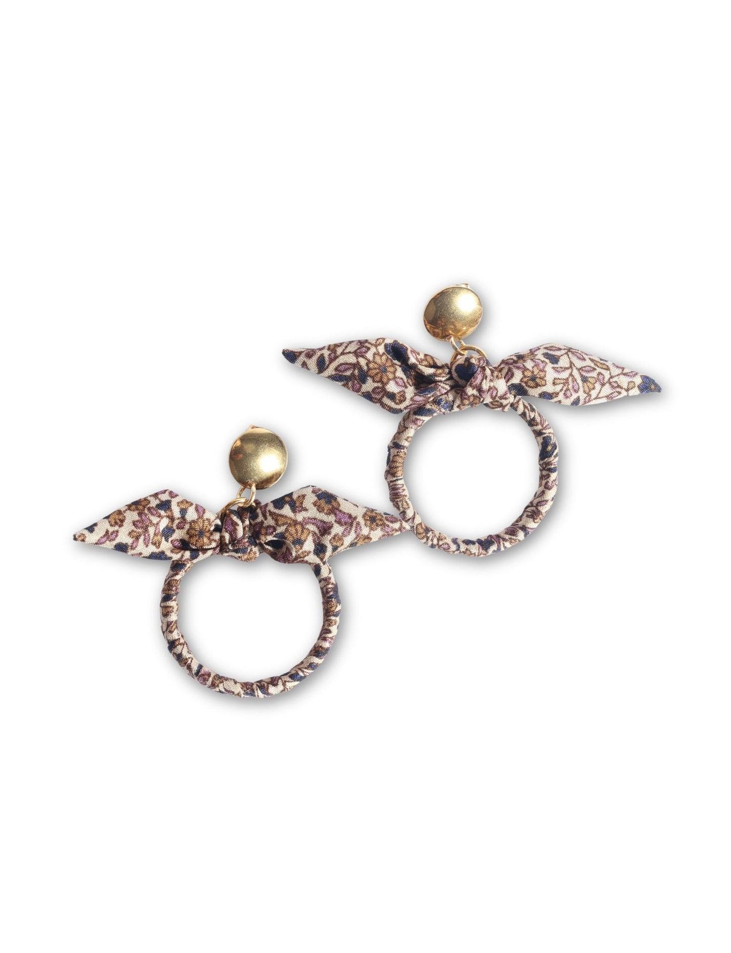 Drop earrings with bow detail and circular ring inspired by upcycled women’s clothing, sustainable women’s clothing, eco friendly clothes, recycled sustainable fashion, carbon neutral clothing, and environment friendly clothing values.